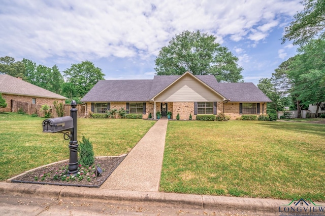 1002 Ruby St, Gilmer, TX 75644 - ranch-style house featuring brick siding, fence, roof with shingles, and a front yard