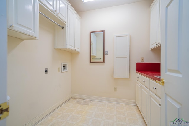 807 Vicksburg Ct, Longview, TX 75601 - laundry area with cabinet space, electric dryer hookup, washer hookup, and light flooring