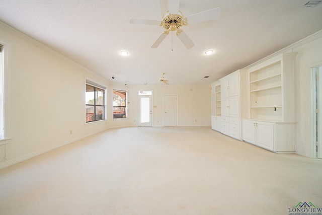 807 Vicksburg Ct, Longview, TX 75601 - unfurnished living room featuring a ceiling fan, light colored carpet, crown molding, and recessed lighting