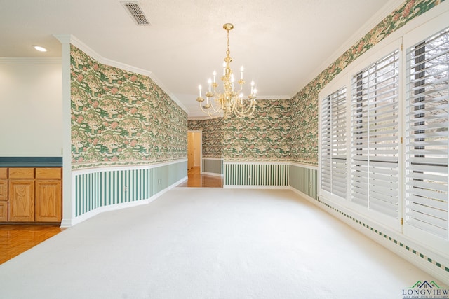 807 Vicksburg Ct, Longview, TX 75601 - empty room featuring wallpapered walls, ornamental molding, wainscoting, and a chandelier