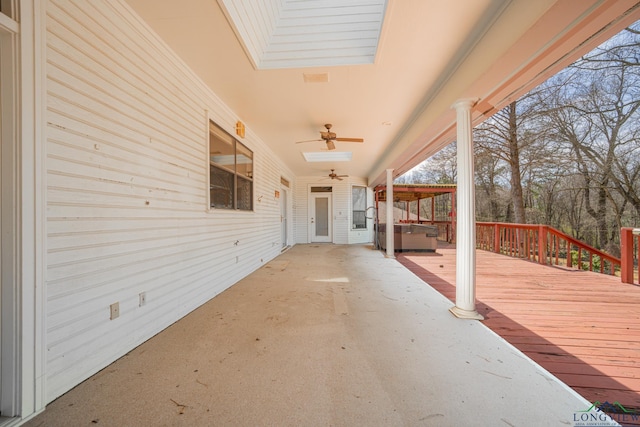 807 Vicksburg Ct, Longview, TX 75601 - wooden deck with ceiling fan, a patio, and a hot tub