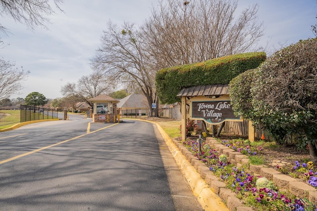 807 Vicksburg Ct, Longview, TX 75601 - view of asphalt street featuring curbs and a gated entry