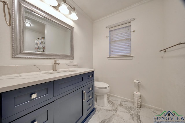 bathroom with crown molding, vanity, and toilet