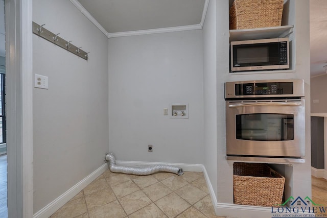 laundry area with ornamental molding, hookup for an electric dryer, tile patterned flooring, and hookup for a washing machine