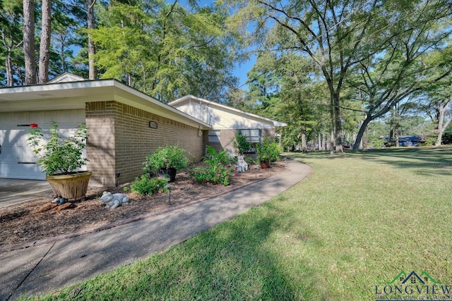 view of side of home with a lawn