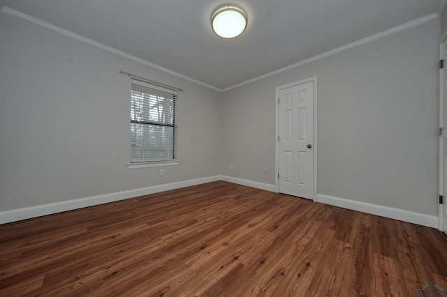 unfurnished room featuring crown molding and dark hardwood / wood-style flooring