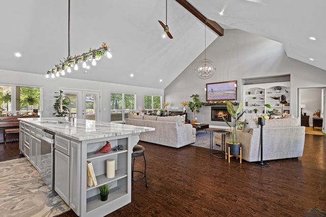 22732 Interstate 20e, Winona, TX 75792 - kitchen with high vaulted ceiling, open shelves, light stone counters, beam ceiling, and open floor plan
