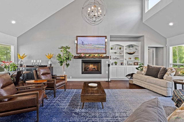 22732 Interstate 20e, Winona, TX 75792 - living area with high vaulted ceiling, a chandelier, a lit fireplace, wood finished floors, and recessed lighting