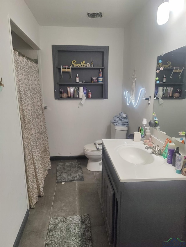 full bath with toilet, baseboards, visible vents, and vanity