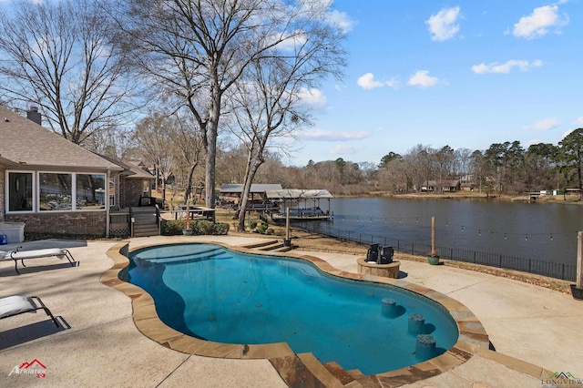 view of pool featuring a fenced in pool, fence, a water view, a dock, and a patio area