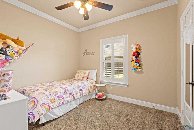123 Park Dr, Kilgore, TX 75662 - bedroom with carpet floors, crown molding, baseboards, and a ceiling fan