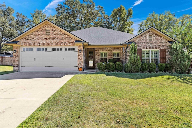 123 Park Dr, Kilgore, TX 75662 - view of front of home featuring brick siding, a garage, a front yard, concrete driveway, and a shingled roof