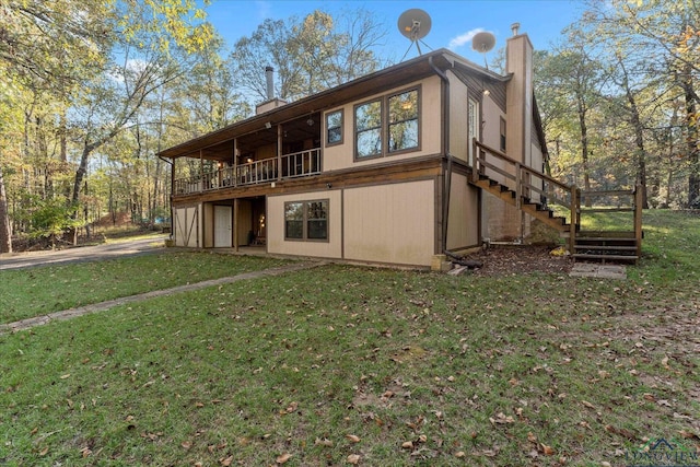 1483 County Road 1596, Avinger, TX 75630 - back of house featuring a chimney, a lawn, and stairs