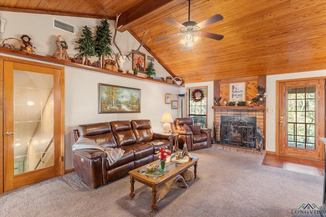 1483 County Road 1596, Avinger, TX 75630 - carpeted living area with wooden ceiling, a fireplace with raised hearth, a ceiling fan, and baseboards