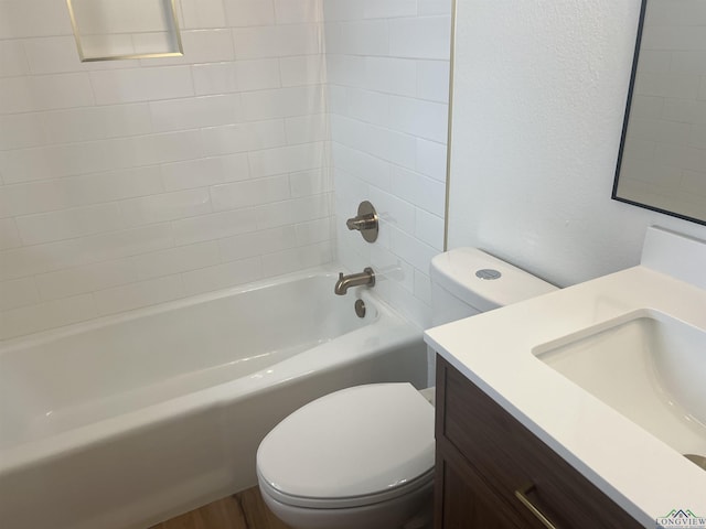 full bathroom featuring shower / bathing tub combination, vanity, and toilet