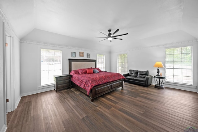 bedroom with ceiling fan, dark hardwood / wood-style floors, and lofted ceiling