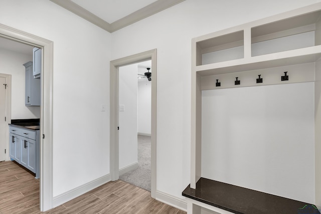 mudroom with ceiling fan and ornamental molding