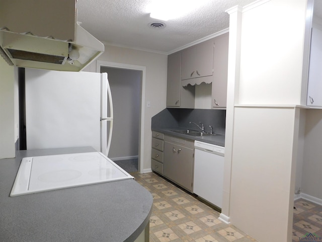 200 Hickory St, Gladewater, TX 75647 - kitchen with white appliances, extractor fan, light floors, a textured ceiling, and ornamental molding