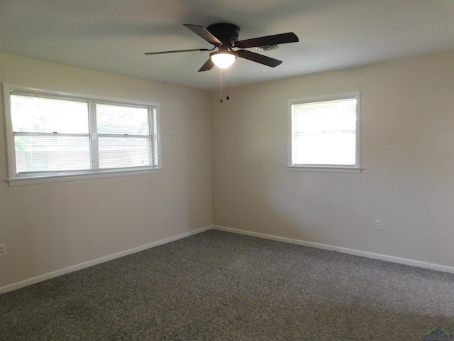 200 Hickory St, Gladewater, TX 75647 - unfurnished room with carpet floors and a ceiling fan