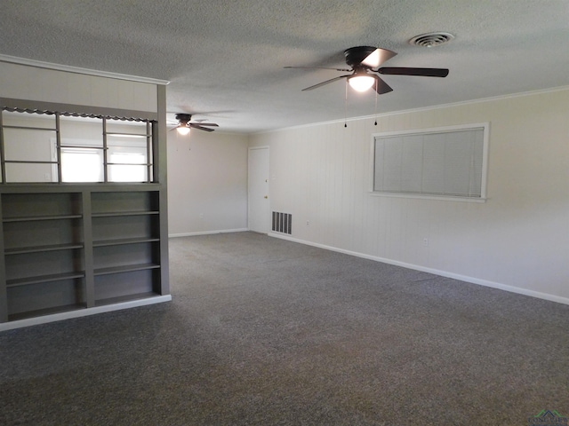 200 Hickory St, Gladewater, TX 75647 - empty room with ceiling fan, ornamental molding, a textured ceiling, and carpet