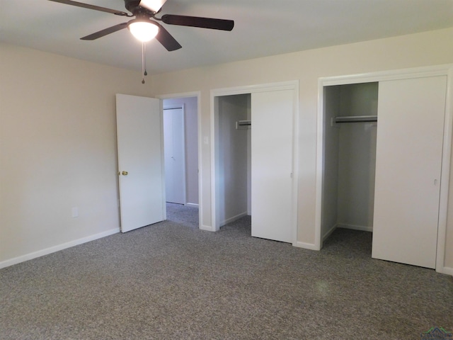 200 Hickory St, Gladewater, TX 75647 - unfurnished bedroom with two closets, carpet flooring, and a ceiling fan