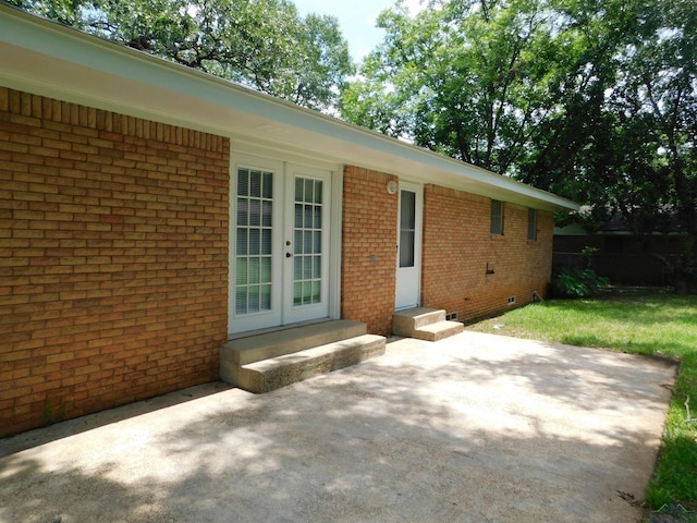 200 Hickory St, Gladewater, TX 75647 - view of patio / terrace with french doors and entry steps
