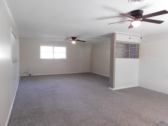 200 Hickory St, Gladewater, TX 75647 - carpeted spare room with a ceiling fan and a textured ceiling