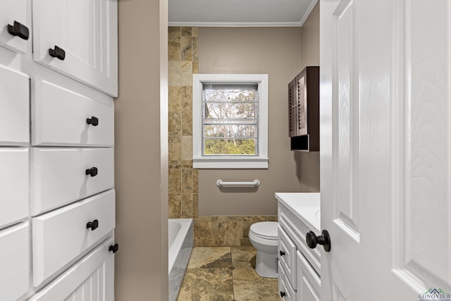 bathroom featuring toilet, vanity, and crown molding