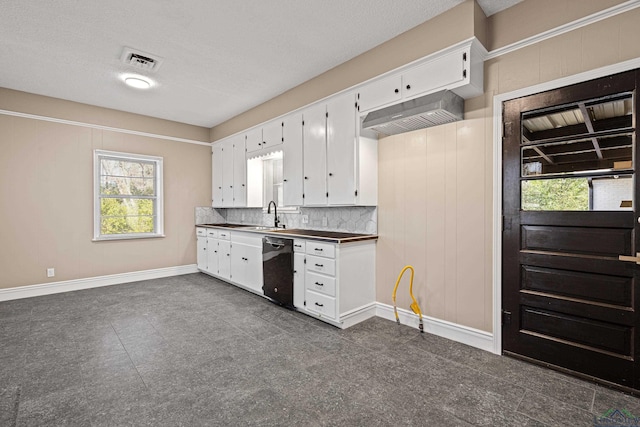 kitchen with a wealth of natural light, black dishwasher, white cabinetry, and sink