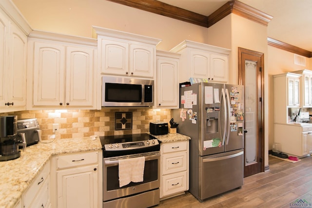 kitchen featuring crown molding, decorative backsplash, light stone counters, dark hardwood / wood-style flooring, and stainless steel appliances