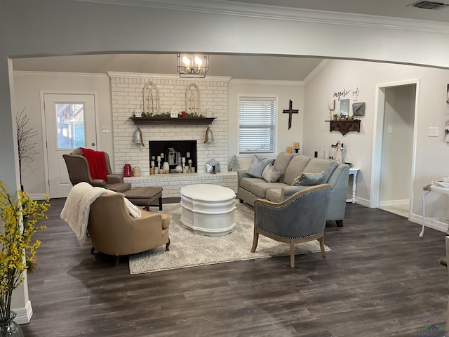 living room featuring ornamental molding, dark wood-style flooring, and a healthy amount of sunlight