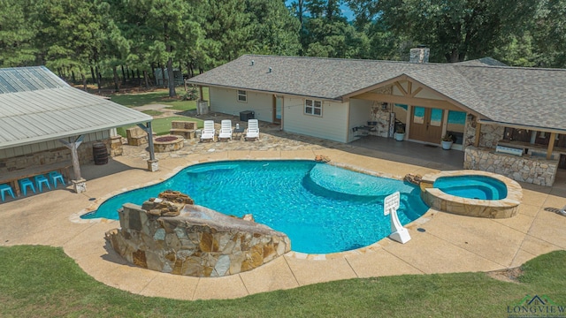 322 Roy Green Rd, Longview, TX 75602 - view of swimming pool with area for grilling, a fire pit, a patio, a pool with connected hot tub, and view of scattered trees