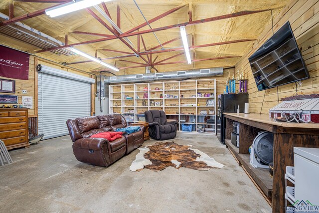 322 Roy Green Rd, Longview, TX 75602 - garage with wooden walls and freestanding refrigerator
