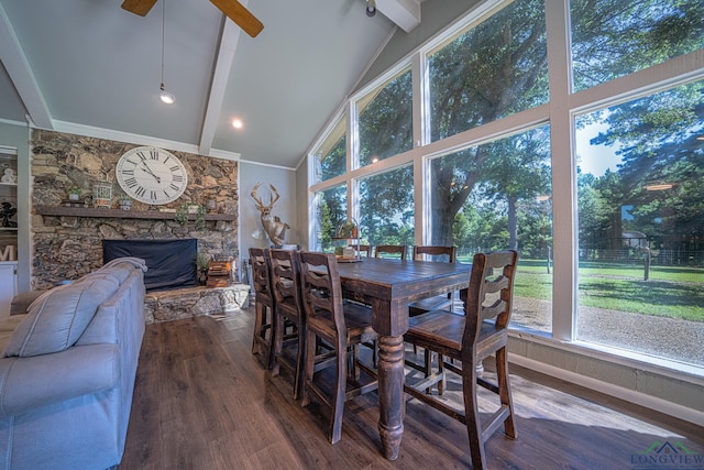 322 Roy Green Rd, Longview, TX 75602 - dining room featuring beam ceiling, dark wood-style floors, a fireplace, a ceiling fan, and high vaulted ceiling