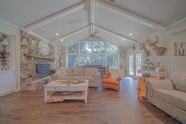 322 Roy Green Rd, Longview, TX 75602 - living room with ceiling fan, wood finished floors, french doors, ornamental molding, and a stone fireplace