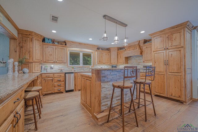 322 Roy Green Rd, Longview, TX 75602 - kitchen with a breakfast bar area, custom range hood, light wood-type flooring, backsplash, and recessed lighting