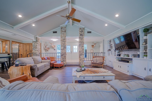 322 Roy Green Rd, Longview, TX 75602 - living room featuring beamed ceiling, wood finished floors, a stone fireplace, a ceiling fan, and high vaulted ceiling