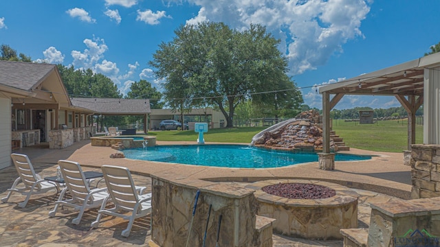 322 Roy Green Rd, Longview, TX 75602 - view of swimming pool with a fire pit, a lawn, a patio, and a pool with connected hot tub