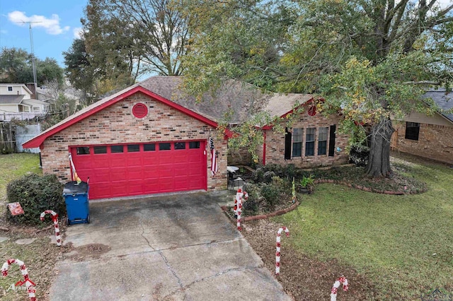 view of front facade featuring a garage and a front lawn