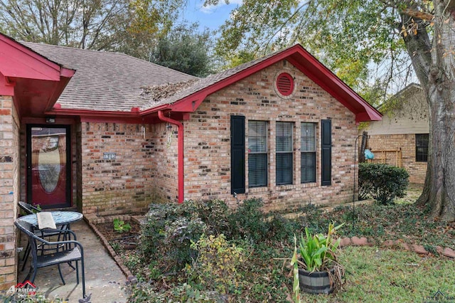 view of side of property with a patio area