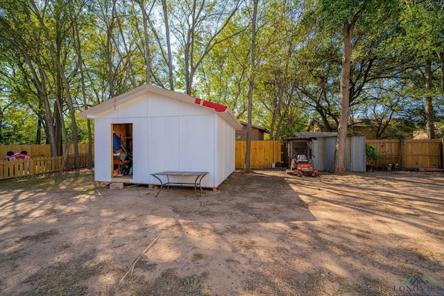 view of shed featuring a fenced backyard