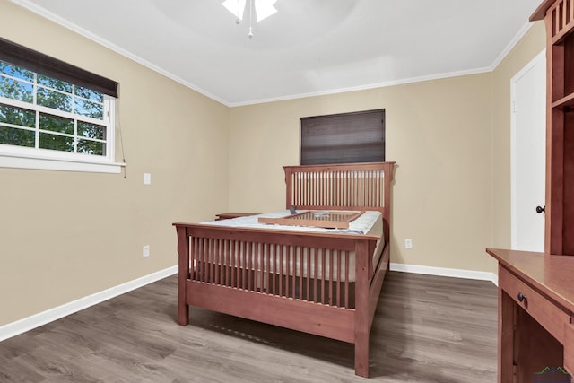 bedroom with wood-type flooring, ceiling fan, and crown molding