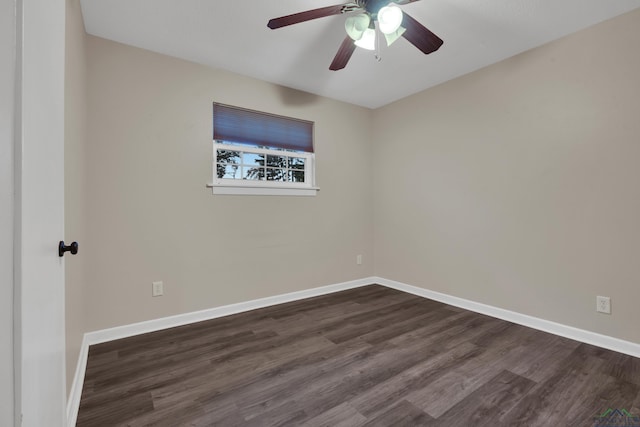 unfurnished room featuring ceiling fan and dark wood-type flooring