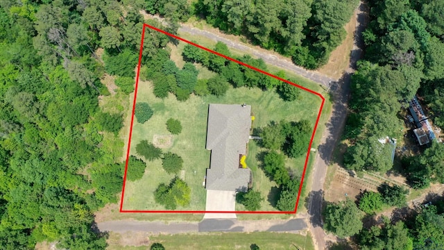 aerial view featuring a wooded view
