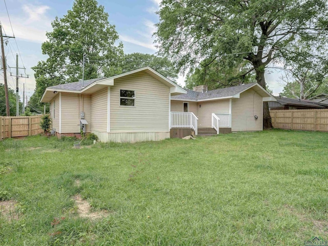 3902 Hazel St, Texarkana, TX 75503 - back of property with a wooden deck and roof with shingles