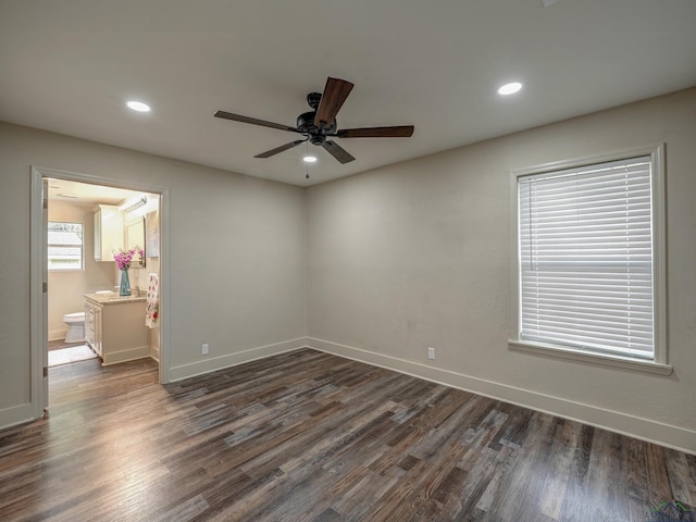 3902 Hazel St, Texarkana, TX 75503 - unfurnished bedroom featuring dark wood-style floors, baseboards, recessed lighting, ensuite bath, and a ceiling fan