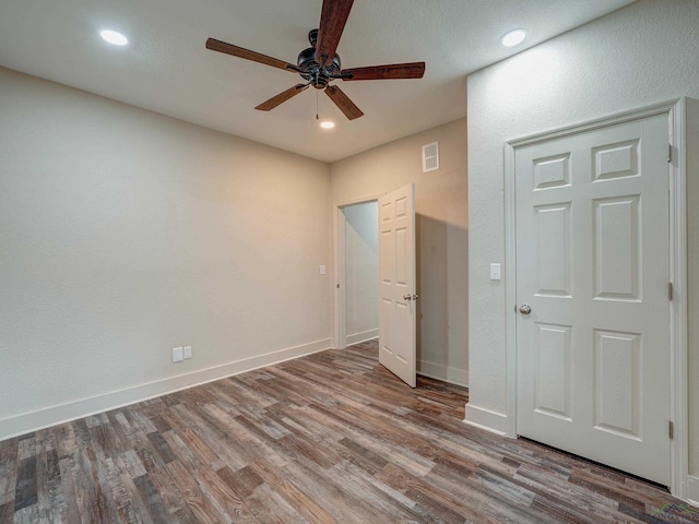 3902 Hazel St, Texarkana, TX 75503 - unfurnished bedroom featuring wood finished floors, recessed lighting, baseboards, and a ceiling fan