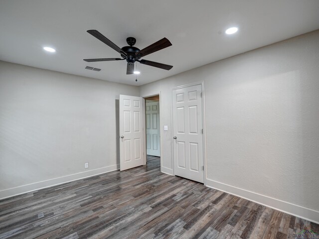 3902 Hazel St, Texarkana, TX 75503 - unfurnished bedroom with baseboards, dark wood finished floors, recessed lighting, and a ceiling fan