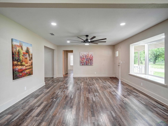 3902 Hazel St, Texarkana, TX 75503 - unfurnished living room with dark wood-style floors, baseboards, ceiling fan, and recessed lighting