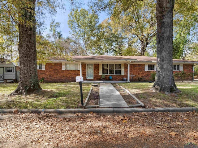 ranch-style house with a front lawn